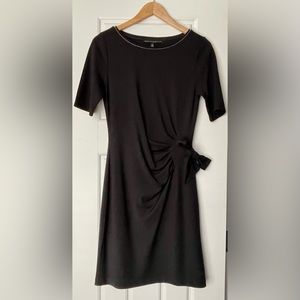 Black cocktail dress, synch waist with tie.